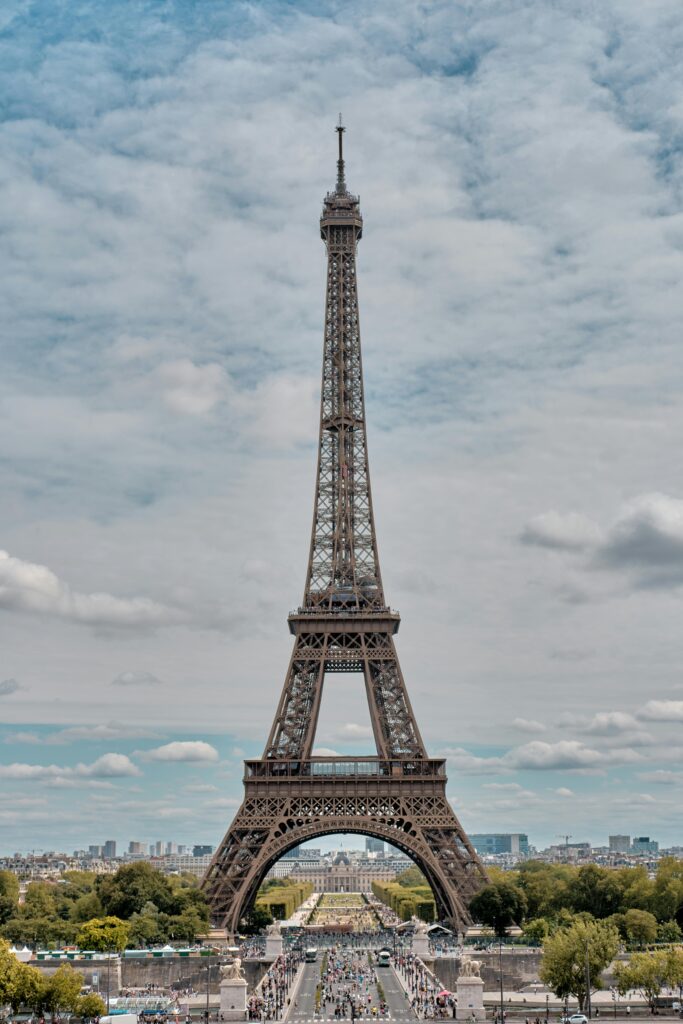 International Marketing & New Market Entry 4 Iconic Eiffel Tower framed by a cloudy sky in Paris, France, showcasing classic architecture.
