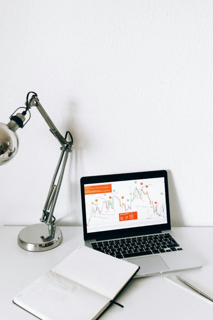 Social Media Marketing for Children's Brands 5 A sleek workspace featuring a laptop displaying data analysis charts, perfect for business and technology themes.
