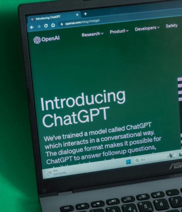 Laptop displaying ChatGPT introduction page on a web browser.